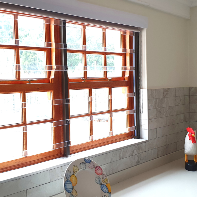 Clearview transparent burglar bars installed on a residential window